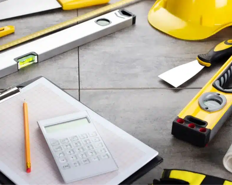 Construction tools and blueprints on a desk