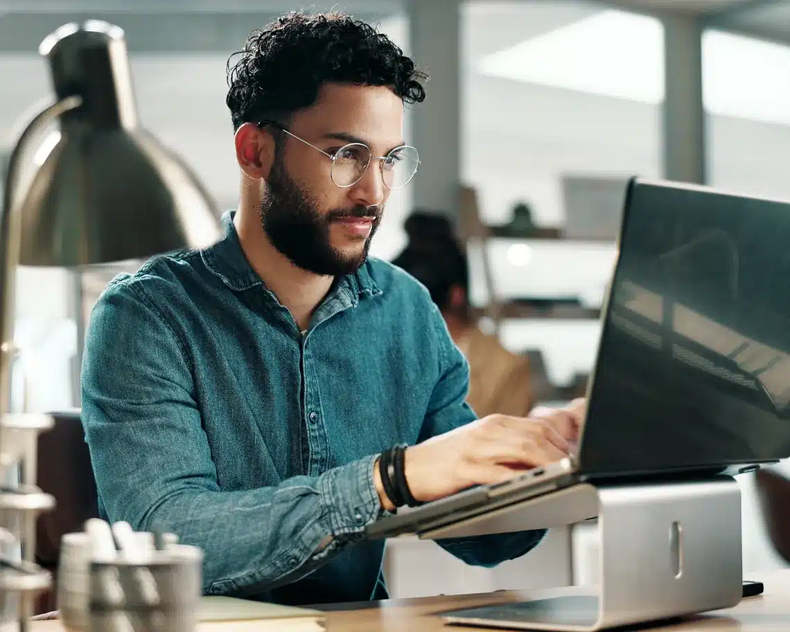 Copywriter writing newsletter laptop