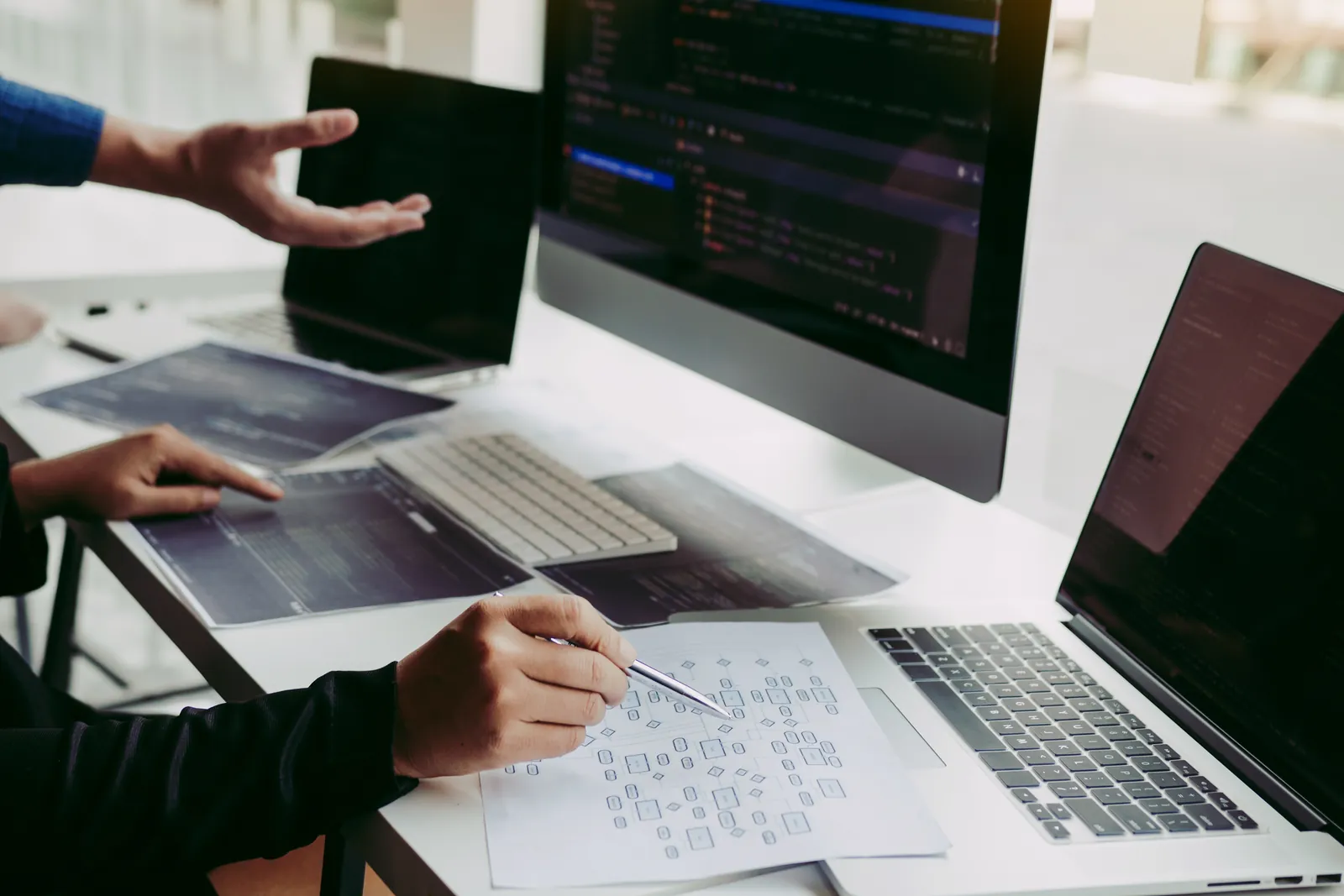 Designer planning a website redesign at a desk