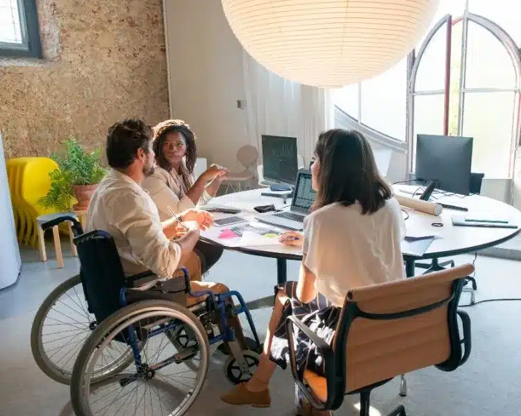 Inclusive team meeting in a bright office