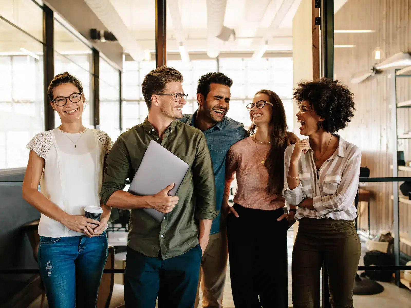 Marketing team standing together in an office