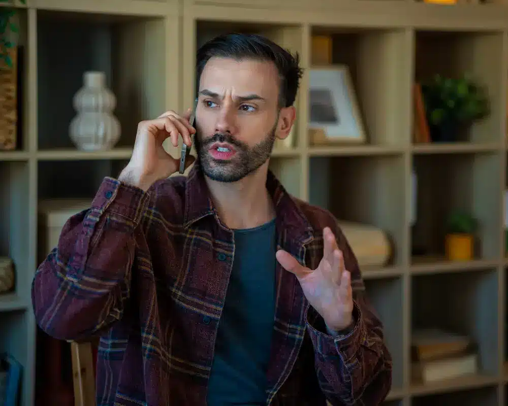 Person calling a law firm on a phone at home