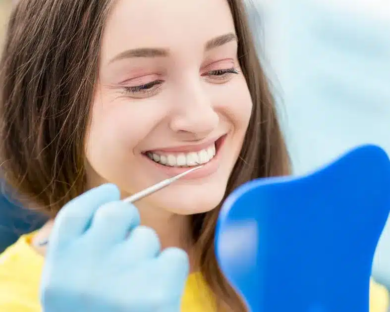 Smiling patient in a dental chair
