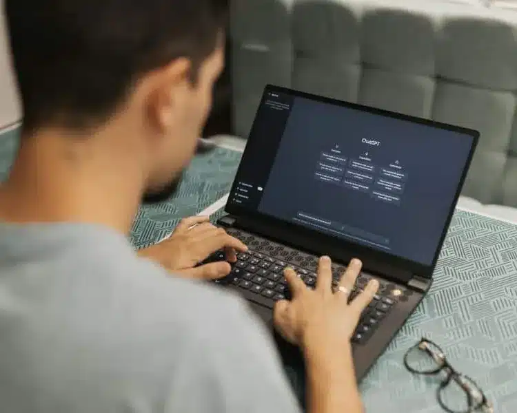 Tech professional working on a laptop